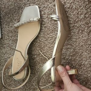 Badgley Mischka Strappy wrap sandals 2" heel with crystal detail embellishments.